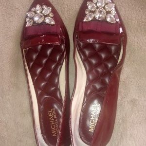 Mikael Kors  burgundy leather jeweled flats.
